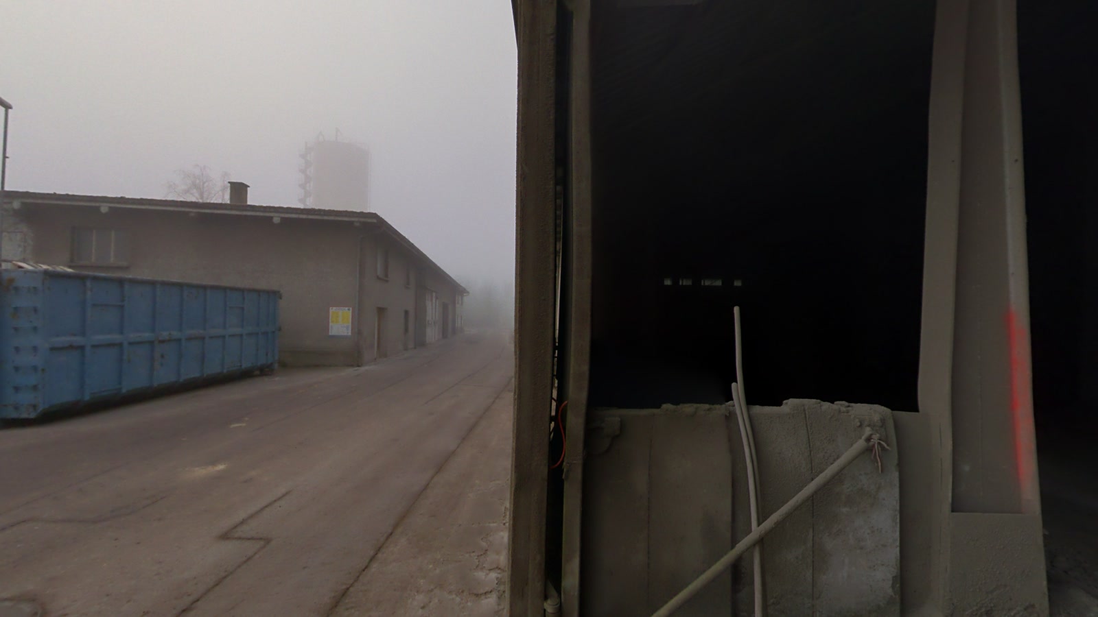 Industrial yard and materials shed viewed through site 360-degree imagery